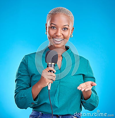 Woman, microphone and studio portrait for interview, news program or questions for talk show by blue background. Young Stock Photo