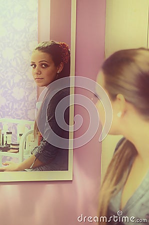 Woman in mirror Stock Photo