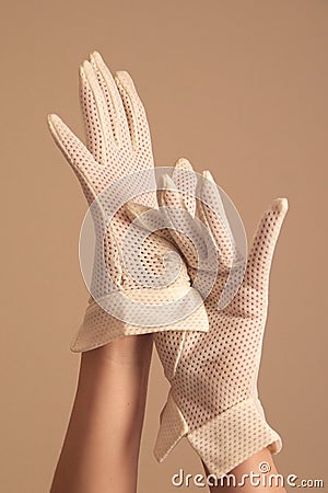 Woman modeling vintage formal white mesh gloves Stock Photo