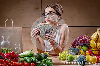 Woman with money cash and healthy food Stock Photo