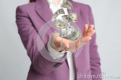 Woman with money on grey background, closeup. Currency exchange Stock Photo