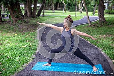 Woman more than 50 year old practicing yoga outdoor location Stock Photo