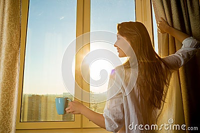 Woman in the morning. Attractive woman with neat body is ho Stock Photo