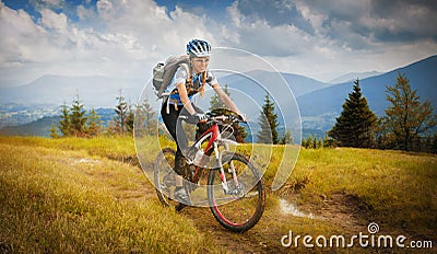 Woman mountain-bike riding Stock Photo