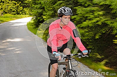 Woman mountain biking motion blur cycling path Stock Photo