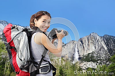 Woman mountain hiker taking pictures in Yosemite Stock Photo