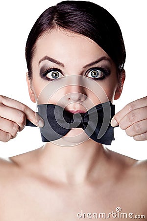 Woman with mouth covered with boy-tie Stock Photo