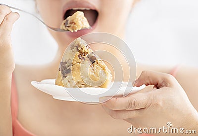 mouth eating traditional rice dumplings Stock Photo