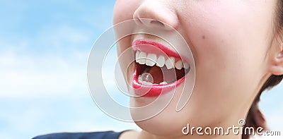 Woman mouth smile with great teeth over blue background. Stock Photo