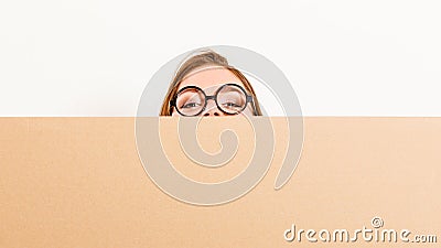 Woman moving in carrying box. Blank copyspace. Stock Photo