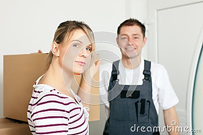 Woman moving in her new house Stock Photo