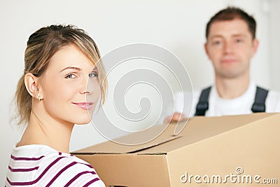 Woman moving in her new house Stock Photo
