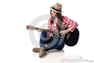 Woman musician playing guitar sitting on floor. Stock Photo