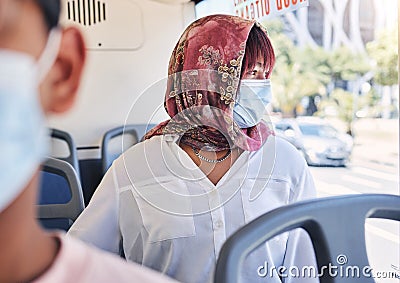 Woman, muslim and bus with mask, covid and healthcare on transport in city, town or metro by window. Islam lady, covid Stock Photo