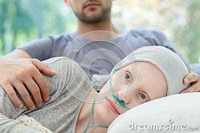 Woman with nasal cannula lying Stock Photo