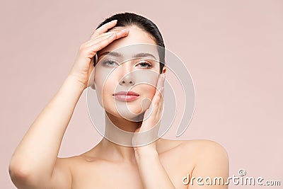 Woman Natural Beauty Makeup Portrait, Fashion Model Touching Face by Hands, Beautiful Girl Skin Care and Treatment Stock Photo