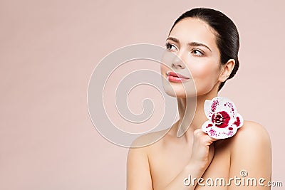 Woman Natural Beauty Makeup Portrait with Flower on Shoulder, Beautiful Girl Skin Care and Treatment Stock Photo