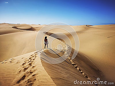 Woman in natural reserve of Dunes of Maspalomas in Gran Canaria, Spain Editorial Stock Photo