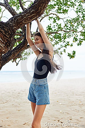 sky woman lifestyle sea relax hanging nature smiling vacation tree sunset Stock Photo