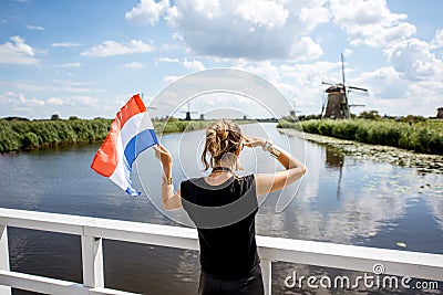 Woman near the old windmills in Netherlands Stock Photo