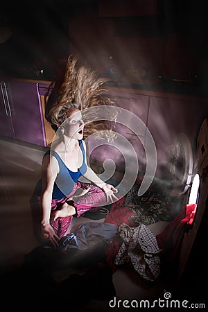 Woman near by washing machine Stock Photo