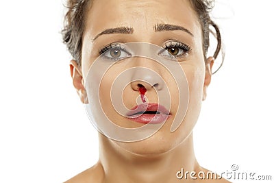 Woman with nose bleeding Stock Photo