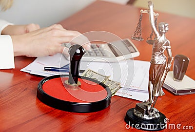 Woman Notary Public calculates the cost Stock Photo