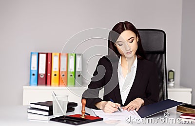 Woman notary public notarizes the document Stock Photo