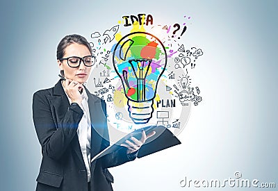 Woman with notebook and glasses and her big idea Stock Photo