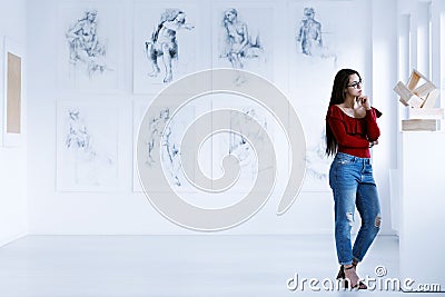 Woman observing contemporary sculpture Stock Photo