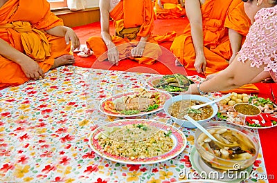 Offering foods to monks in Thai culture Editorial Stock Photo