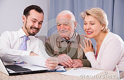 Woman and old man consider contract Stock Photo