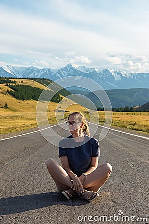 Woman om the Chuysky trakt road in the Altai mountains. Stock Photo