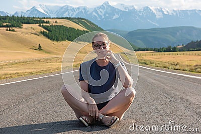 Woman om the Chuysky trakt road in the Altai mountains. Stock Photo