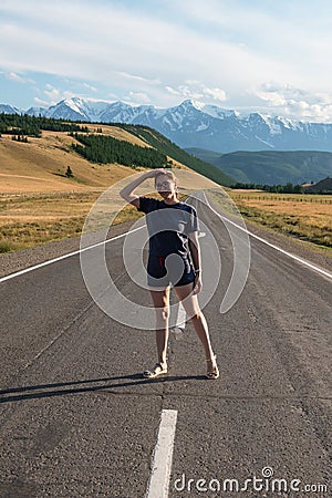 Woman om the Chuysky trakt road in the Altai mountains. Stock Photo