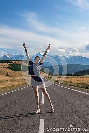 Woman om the Chuysky trakt road in the Altai mountains. Stock Photo