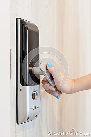 Woman open digital door lock from inside room Stock Photo