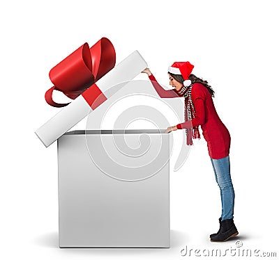 Woman opening a large present Stock Photo