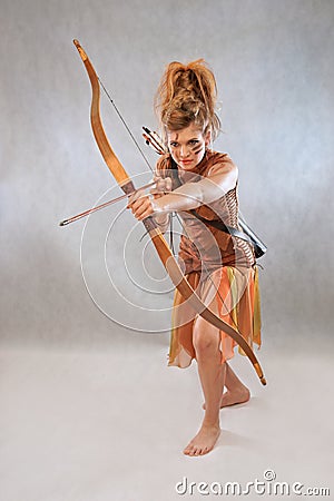 Woman in orange and brown outfit, warrior, fashion, studio Stock Photo