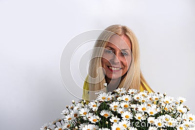 Woman with oxeye daisy Stock Photo
