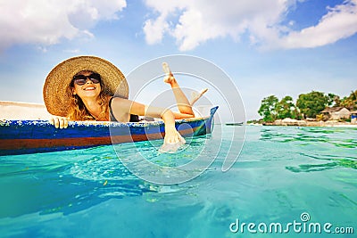 Woman paddling in a boat Stock Photo