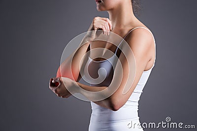 Woman with pain in elbow, joint inflammation Stock Photo