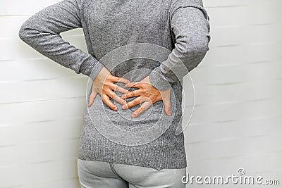 Woman, pain at lower back. Health care concept Stock Photo