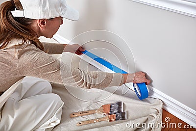 Woman painting wall Stock Photo