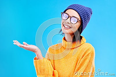 Woman palm, smile and portrait in a studio with promotion and announcement. Excited, isolated and blue background with Stock Photo