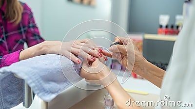 Woman pampering herself with a manicure Stock Photo