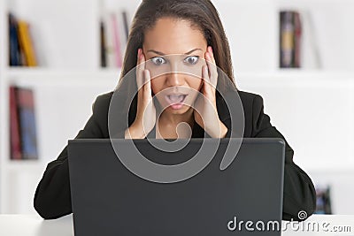 Woman in Panic Looking At A Computer Monitor Stock Photo