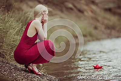 Woman with a paper boat Stock Photo