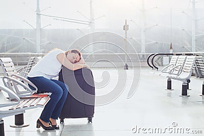 Woman passenger sleeping in the airport Stock Photo