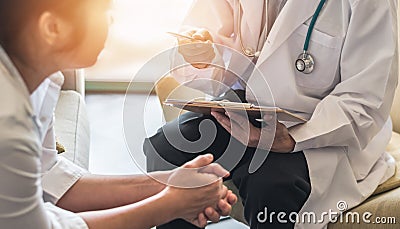 Woman patient with doctor or psychiatrist consulting and diagnostic examining on obstetric - gynecological female illness Stock Photo